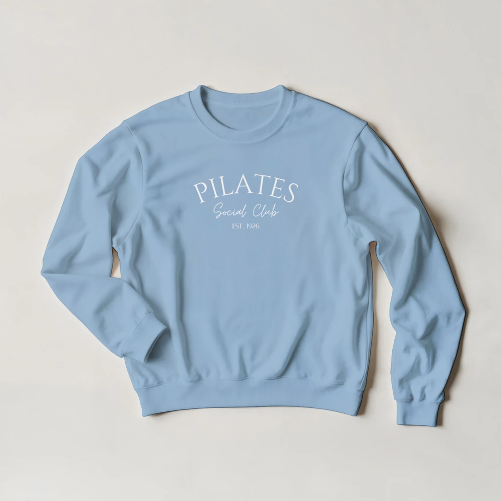 Pilates sweatshirt in blue with 'Pilates Social Club' text.