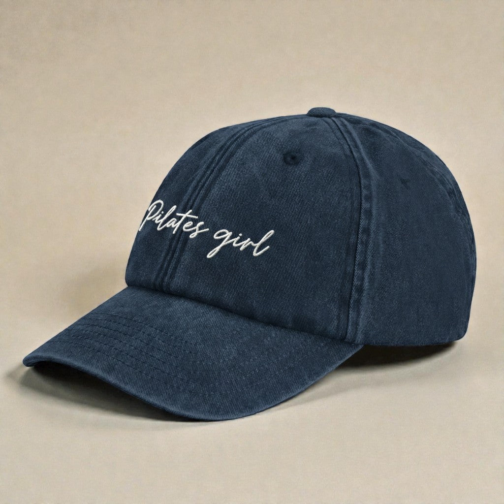Vintage style embroidered dad cap featuring Pilates Girl script lettering designed for Pilates, gym, and everyday wear.