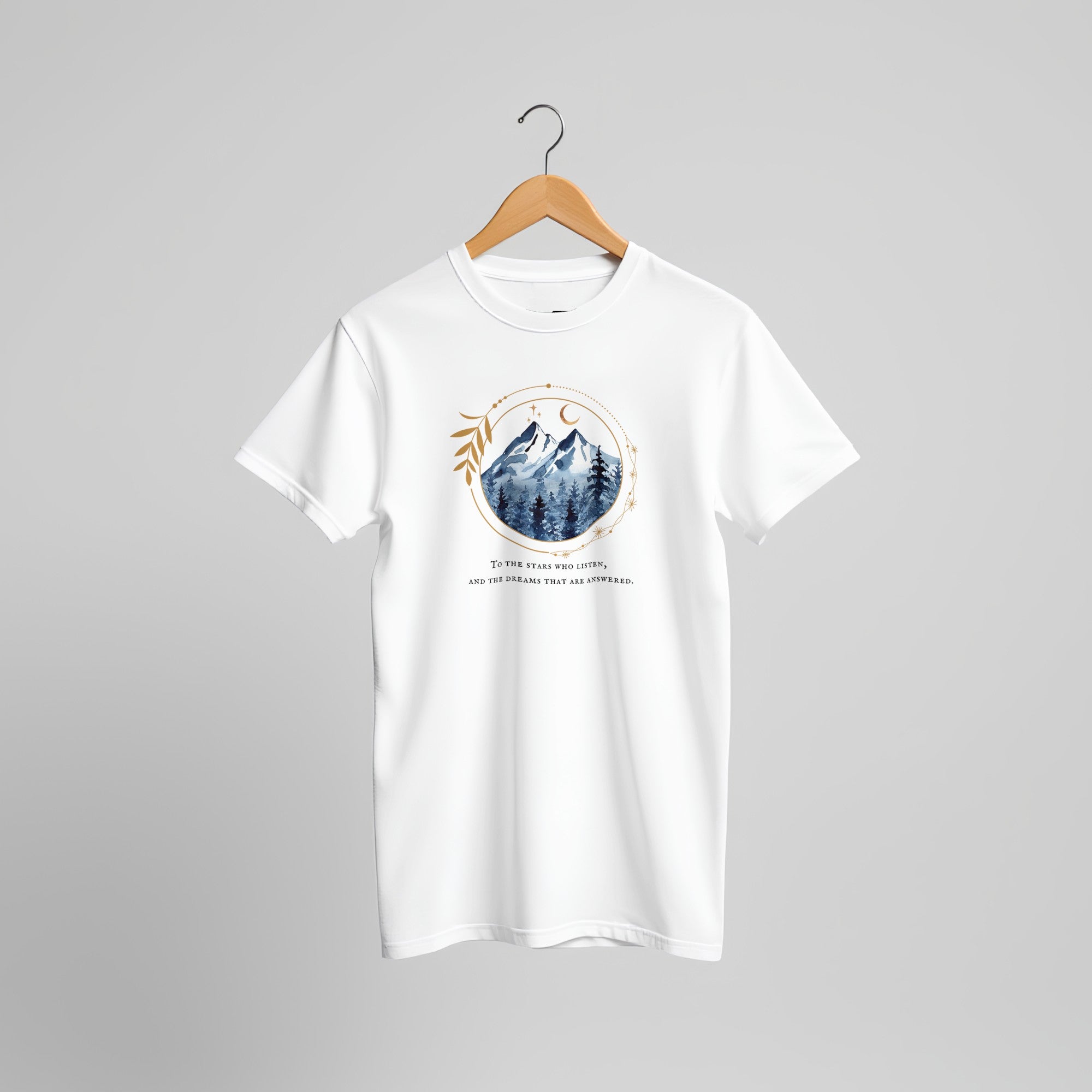White t-shirt with mountain graphic and text on a hanger. Romantasy book lover gift, acotar fan inspired. 