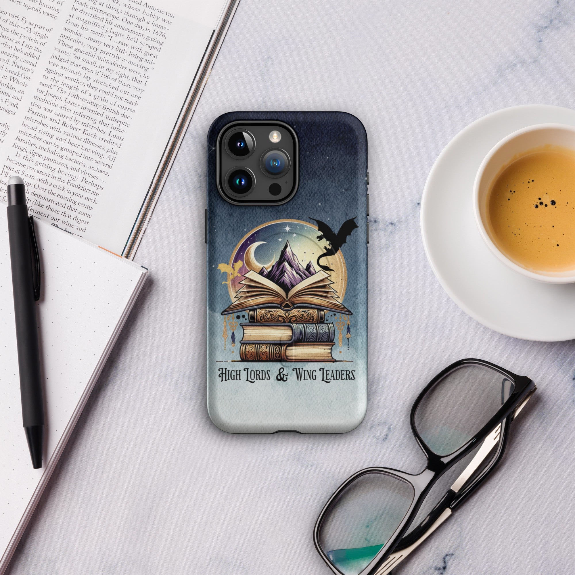 Romantasy fantasy reader phone case with stacked books, open book and dragon silhouette under moon and mountain scene, tough protective aesthetic case.